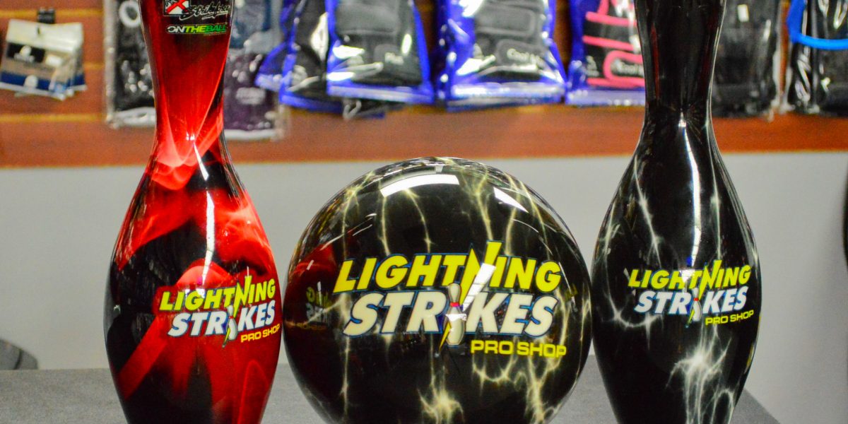 Lightning Strikes Pro Shop Bowling Ball and Bowling Pins